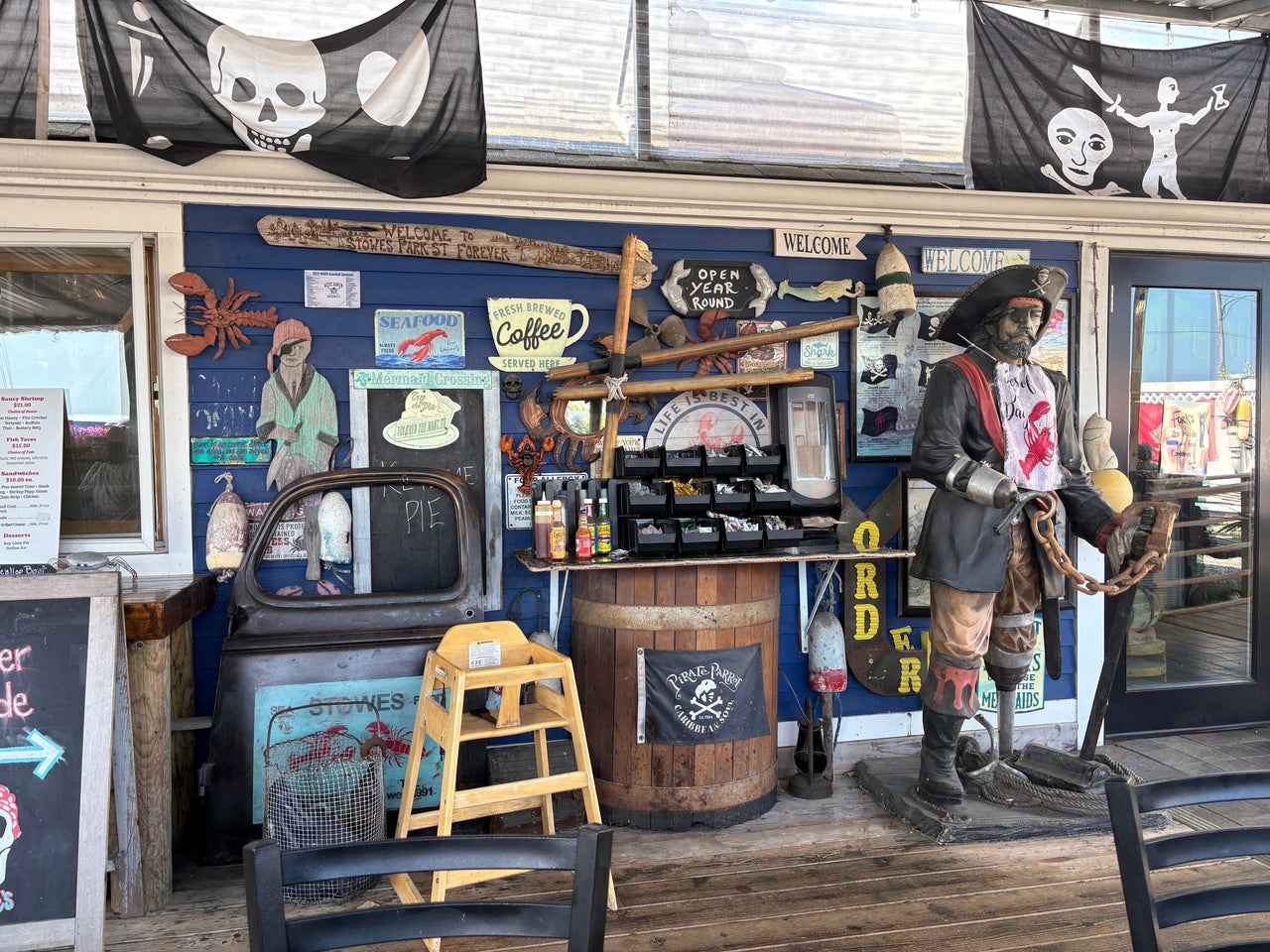 Stowe’s Seafood shack across from West Haven Beach, with pirate flags, fried food in paper trays, and picnic tables full of happy customers.