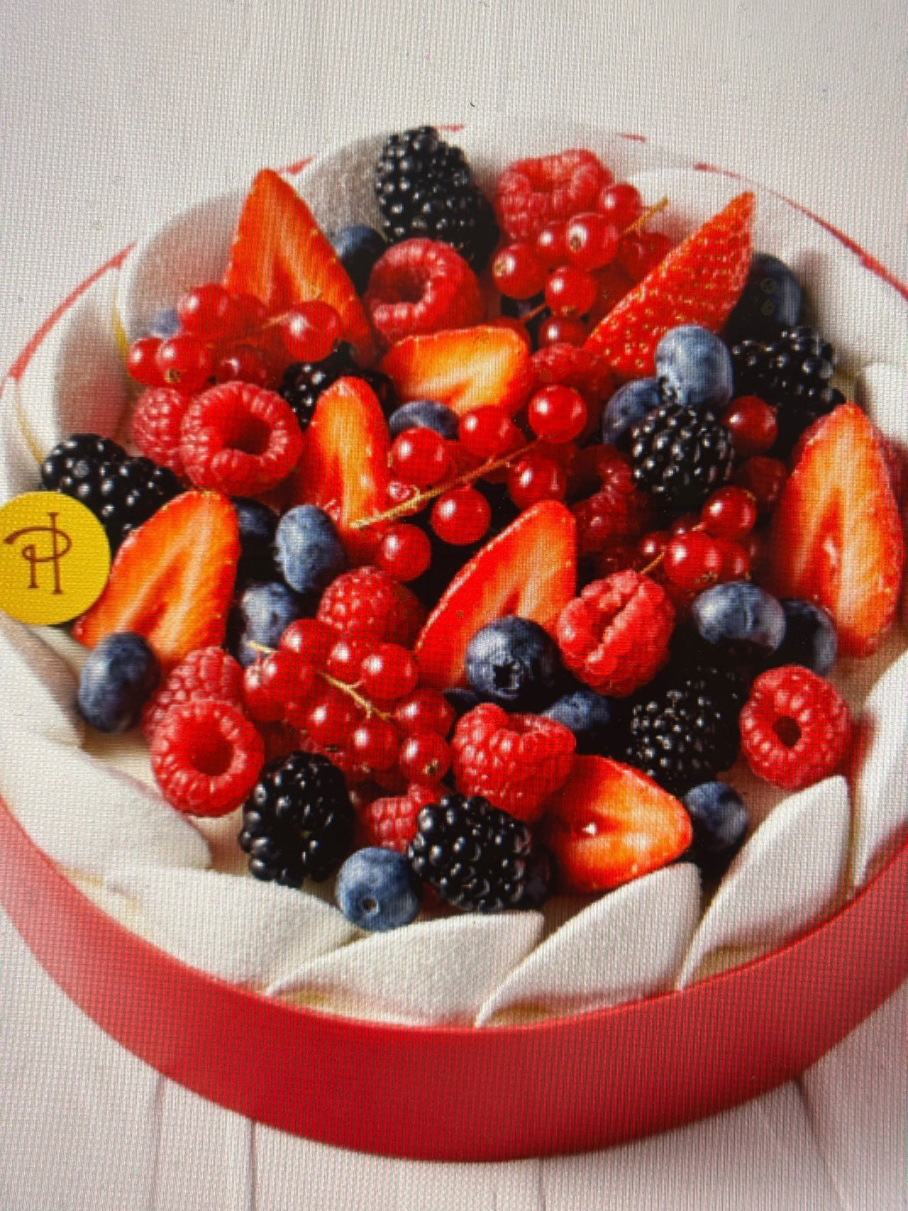 Ella: For the best of the best amongst Pierre Hermé pastries and macarons in a Paris boutique, featuring the Ispahan, Infiniment Vanille, and other luxury dessert masterpieces.