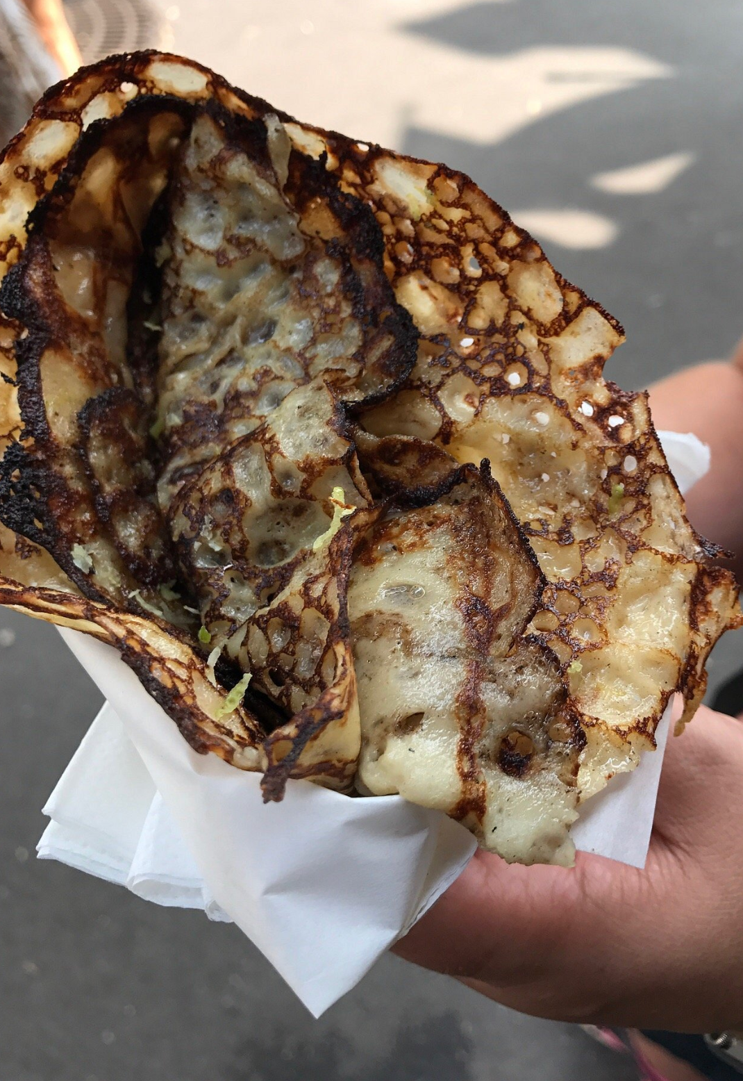 Freshly made golden-brown crêpe stuffed with sugar and dreams at Chez Alain Miam Miam in Paris.